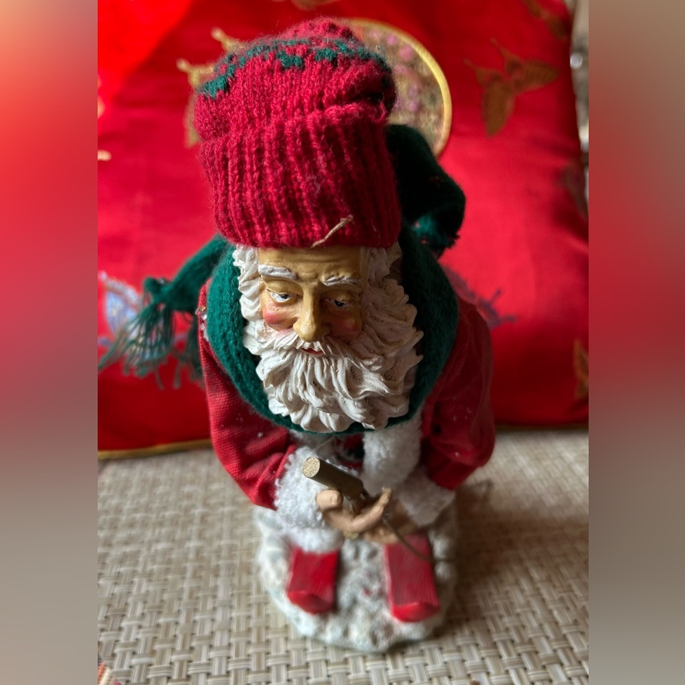 Collectable Santa Figurine on skies. resin “Clothique” 9 1/2 “ tall